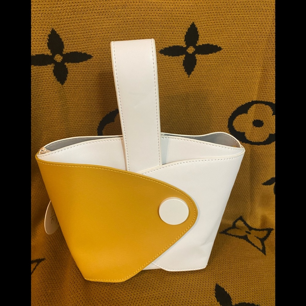 NWT yellow and white leather mini handbag .
